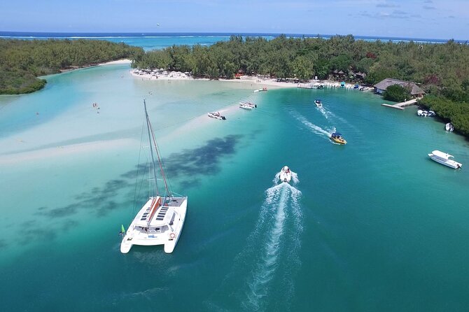 Catamaran cruising through a turquoise Mauritius lagoon